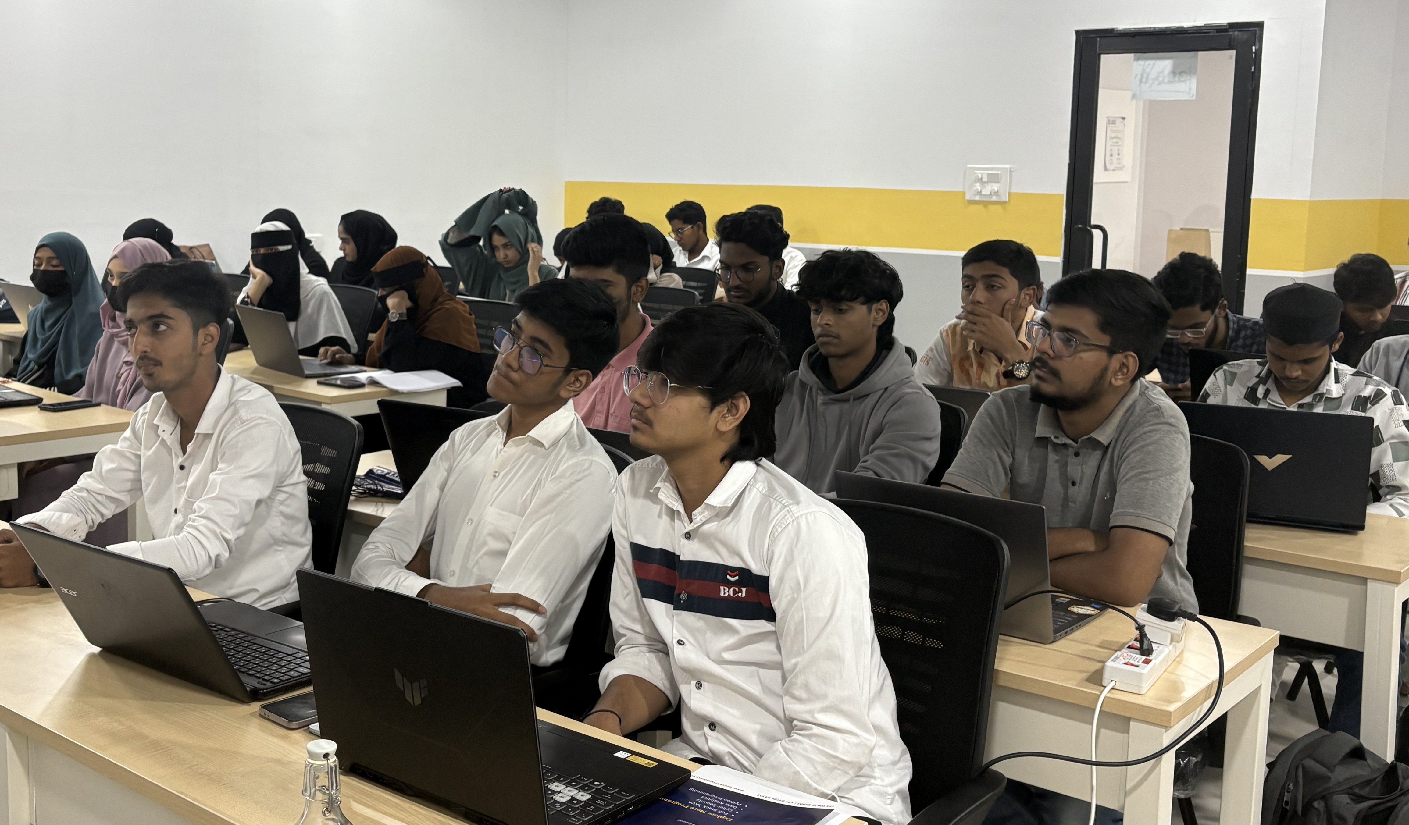 Participants in Python workshop building data visualization projects
