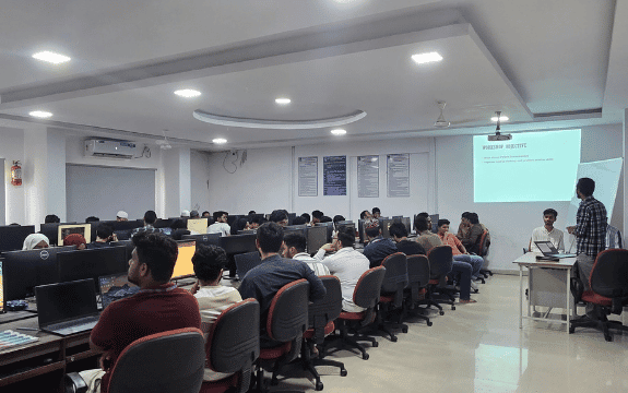 Students learning technology at computers in an LSA classroom